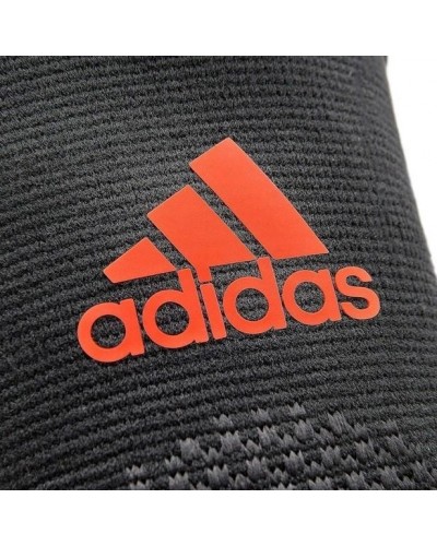Фіксатор ліктя Adidas Performance Elbow Support чорний, червоний Уні L (ADSU-13333RD)